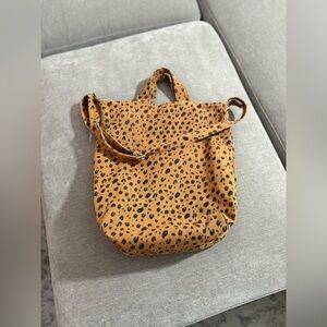 Baggu Duck Bag in a leopard print pattern and cotton canvas material.